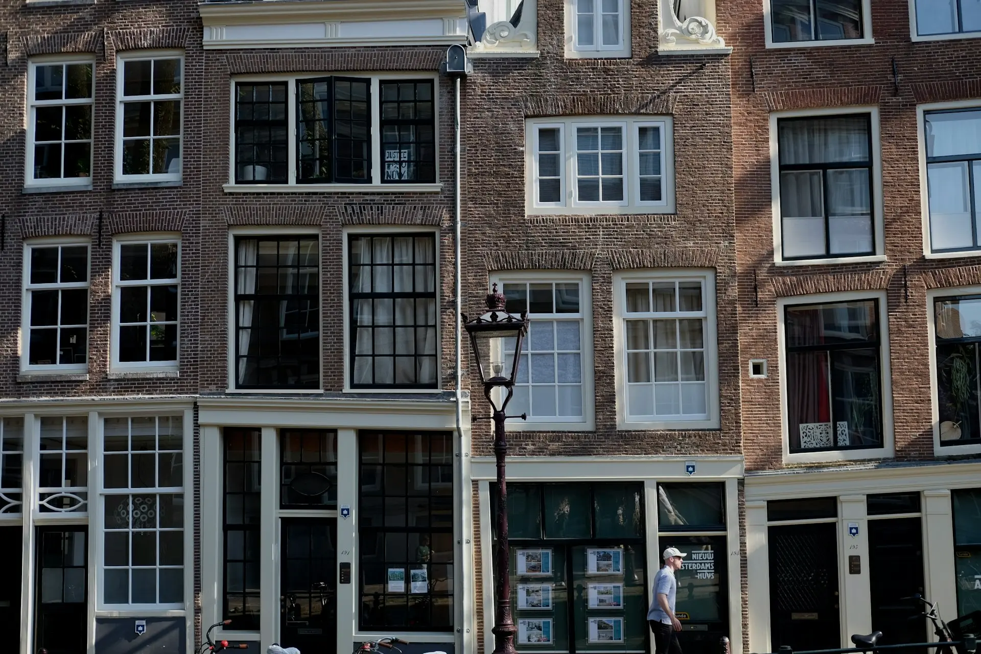 A large building with many windows and a clock on the front of it